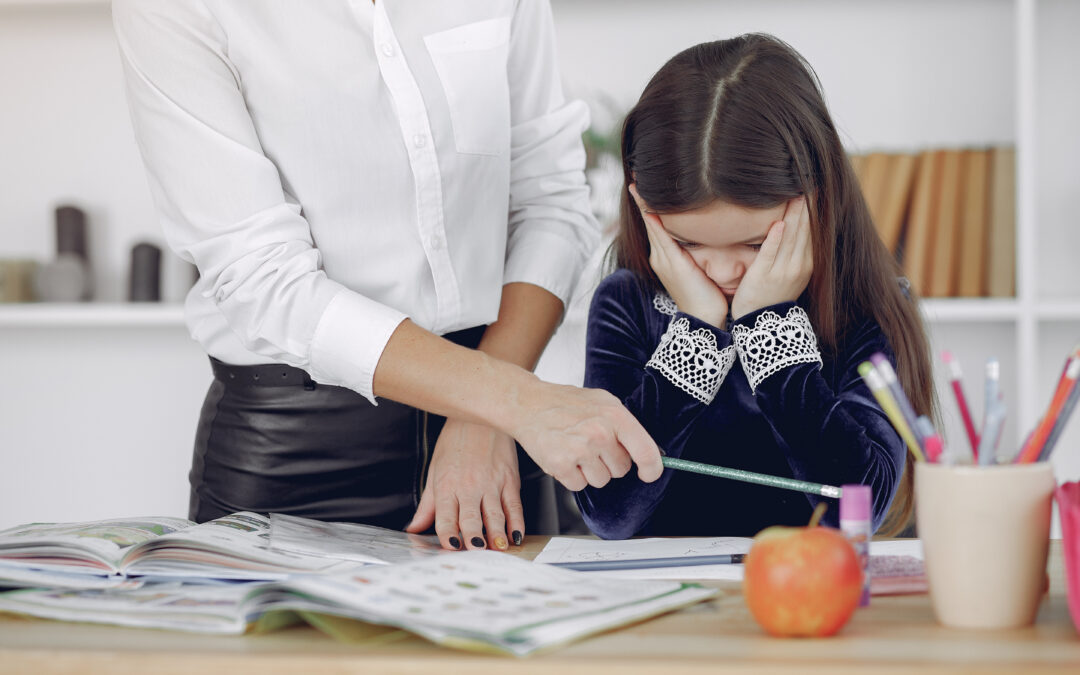 Phoenix parent documenting IEP non-compliance at home desk with service log and dated notes