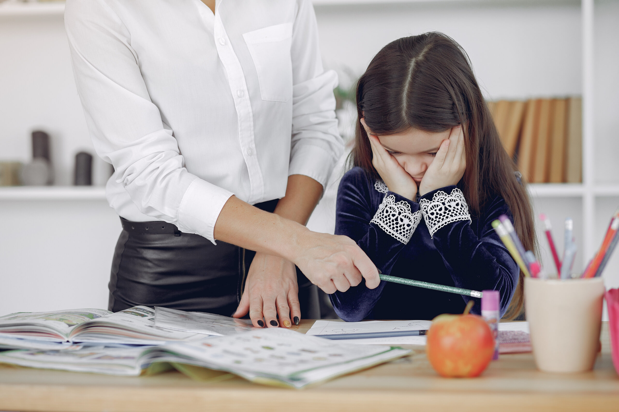 Phoenix parent documenting IEP non-compliance at home desk with service log and dated notes